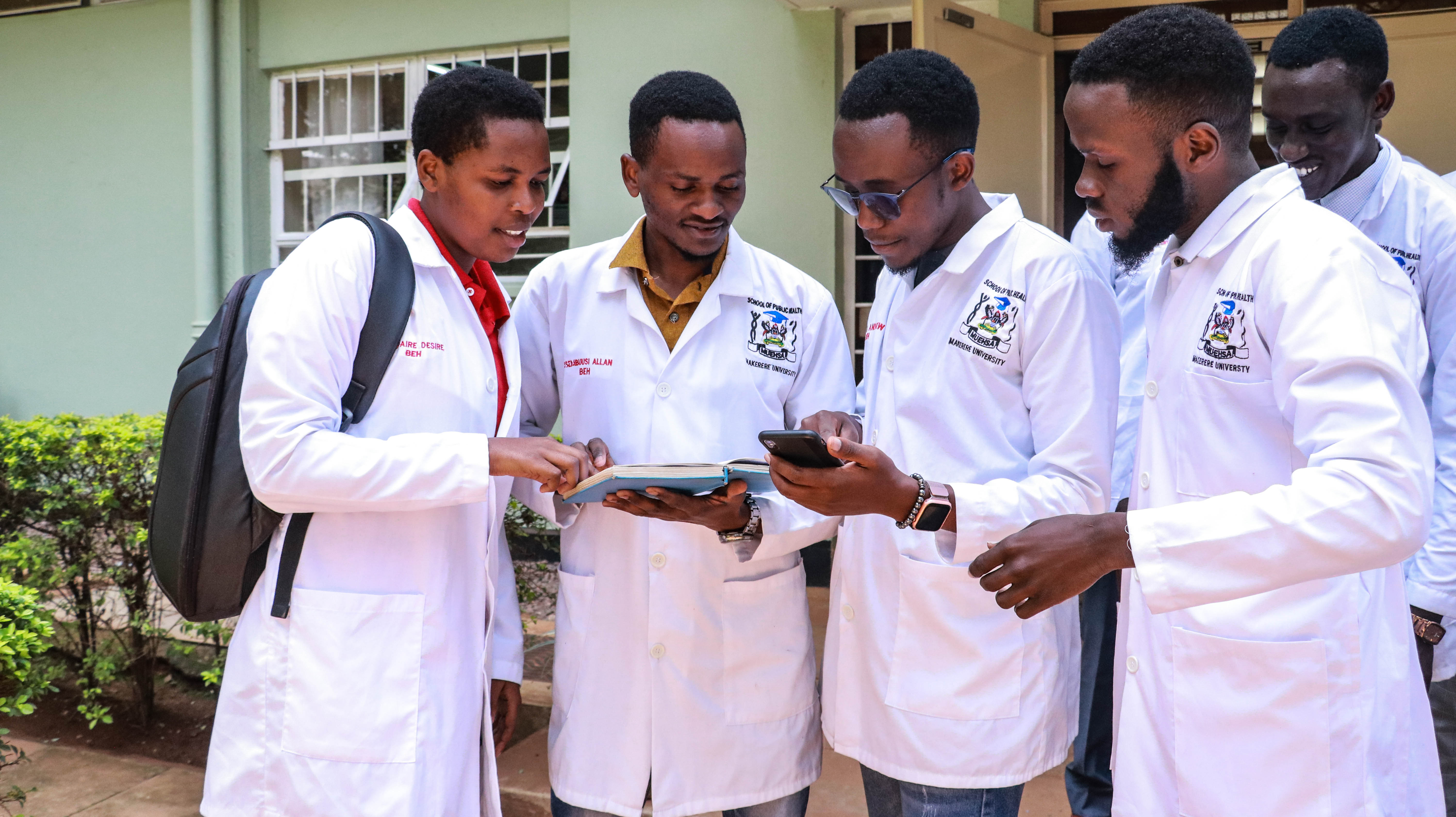 Allan Ssembuusi, (second left) discussing with classmates at Makerere School of Public Health last year.