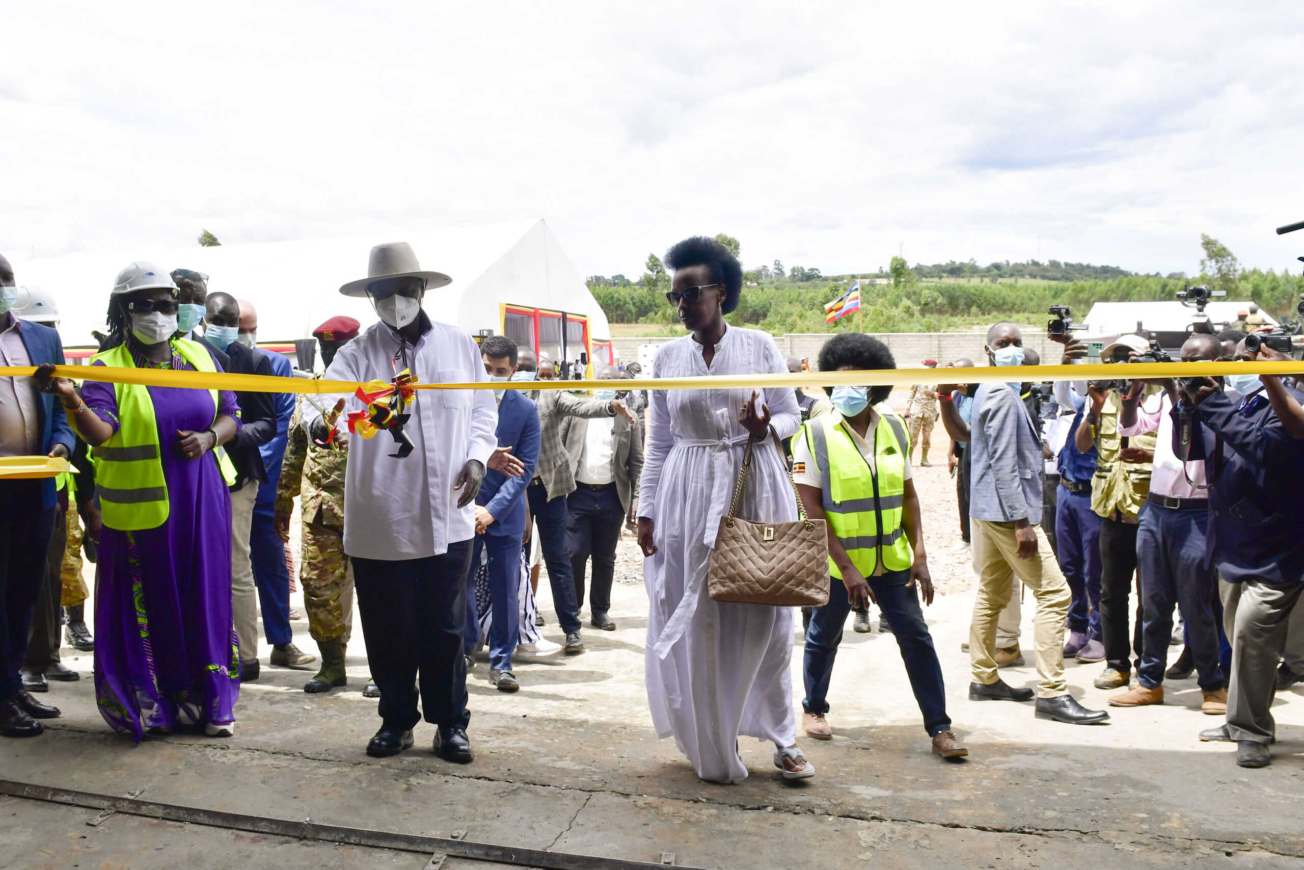 President Museveni accompanied by Natasha Karugire cuts the tape as he commissions Woodcross Tin Smelting Refinary in Mbarara on Friday. PPU Photo scaled dsgG3y MooChat Plus