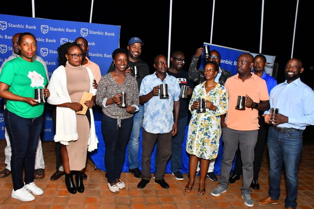 The different winners pose with their Mugs during the dinner scaled MooChat Plus